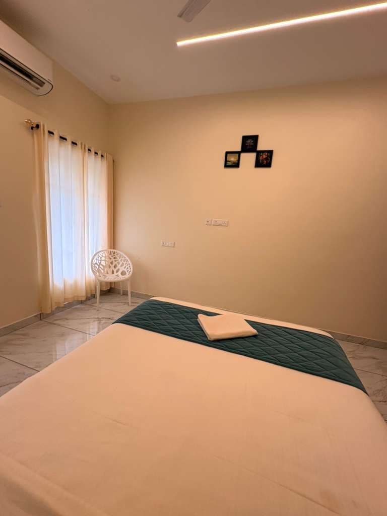 AC Executive Room bed with private balcony access